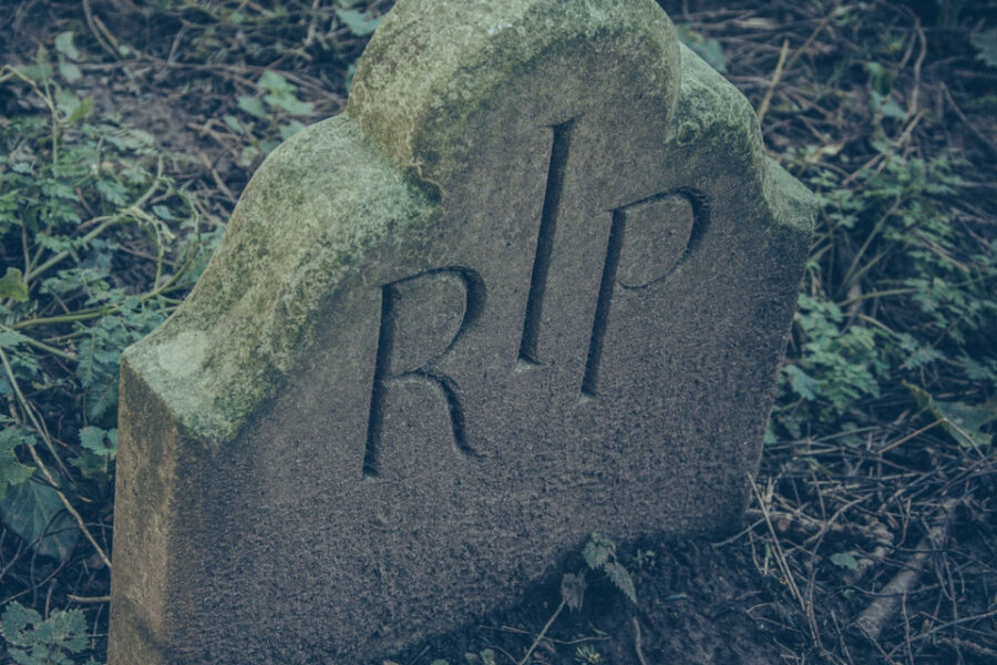 Gravestone with the letters RIP carved on its surface